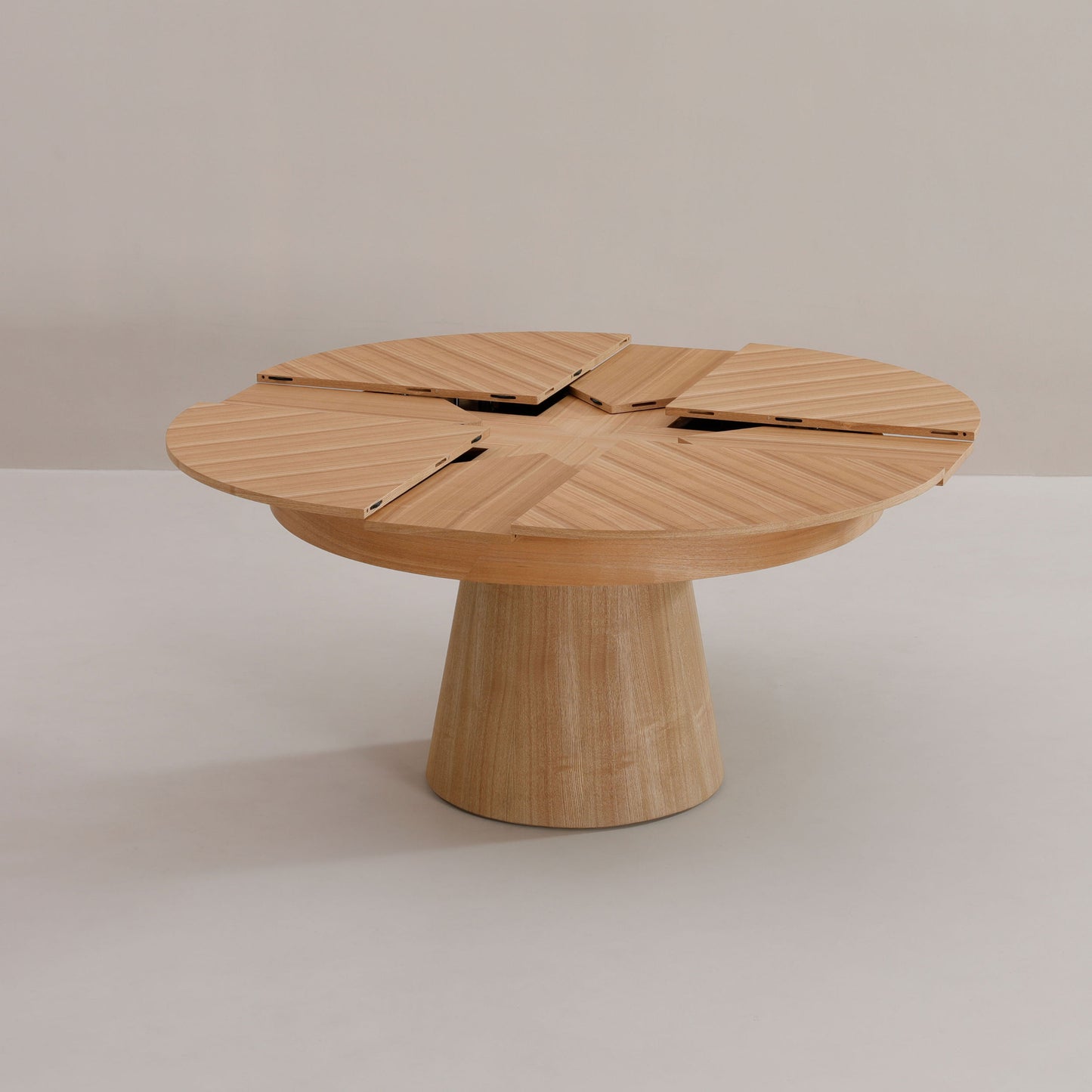 Round partially opened capstan table by Expand Furniture | Oak Wood