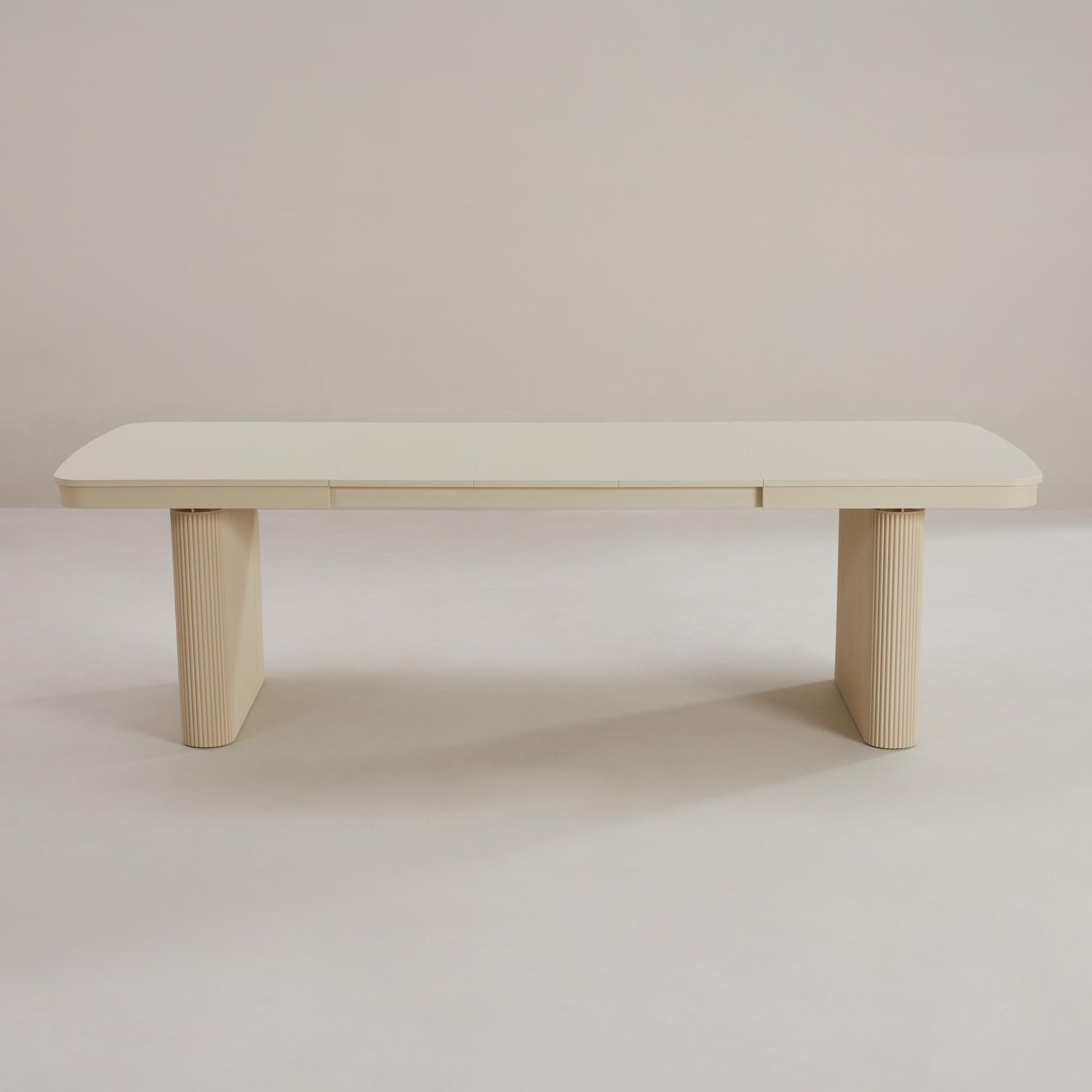 long rectangle table changes size with stored leaflets - curved design with fluted base