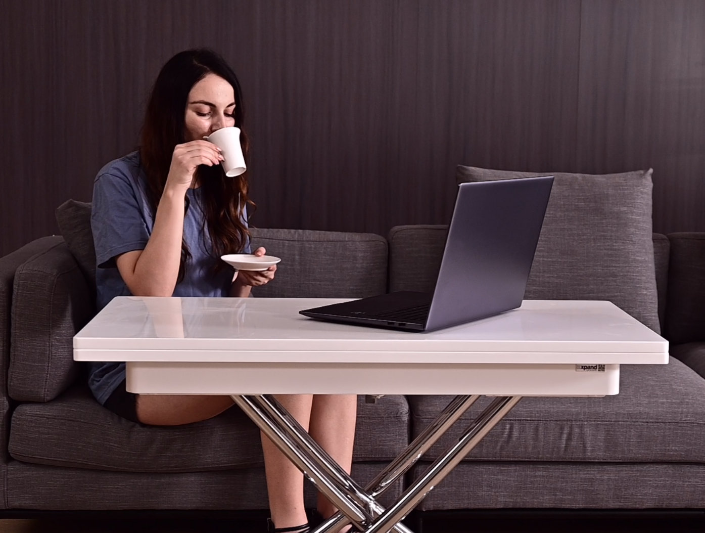 Coffee transforming table is height adjustable for work at the couch