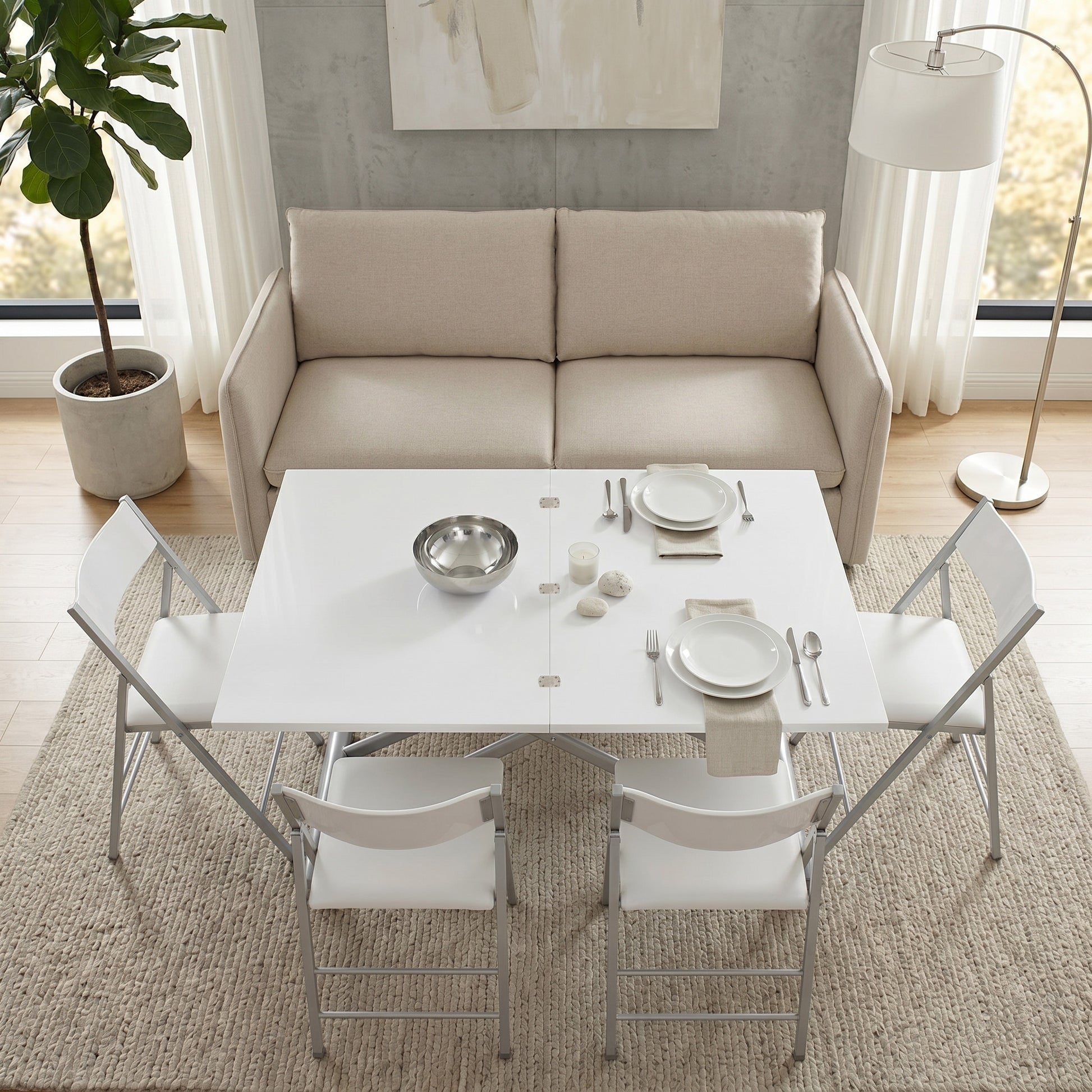 Modern dining set with white table and chairs in a living room setting. | Glossy White