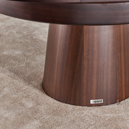 Close up of compass round expanding table top in walnut with base