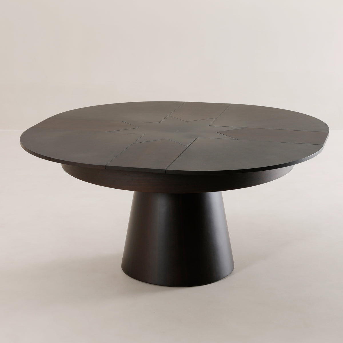 Compass round expanding table rotated open to dinner size | Walnut