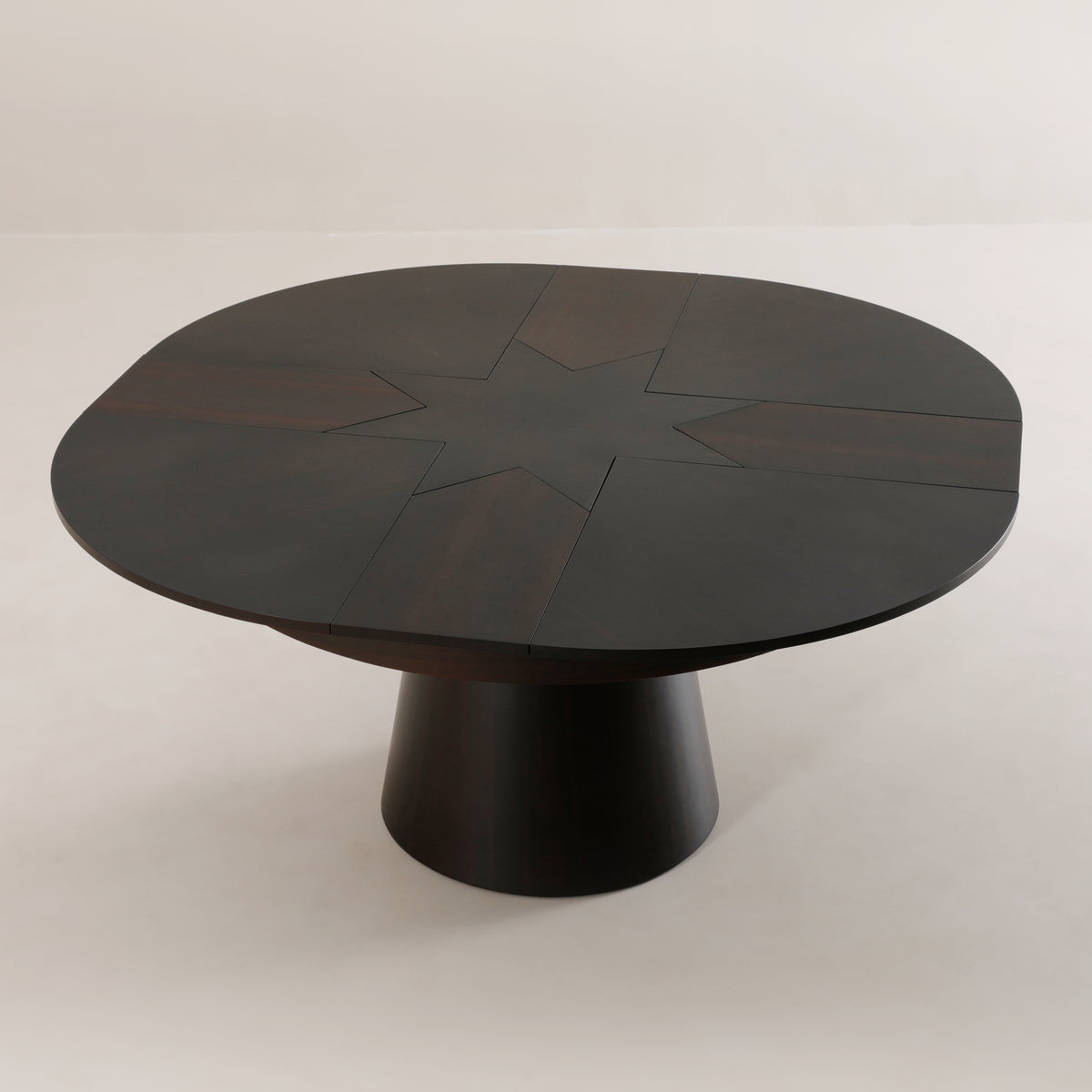 Compass round expanding table rotated open to dinner size from above | Walnut