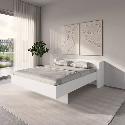Modern bedroom with Expanse Inverse Murphy Bed white , gray bedding, and framed artwork on the wall.