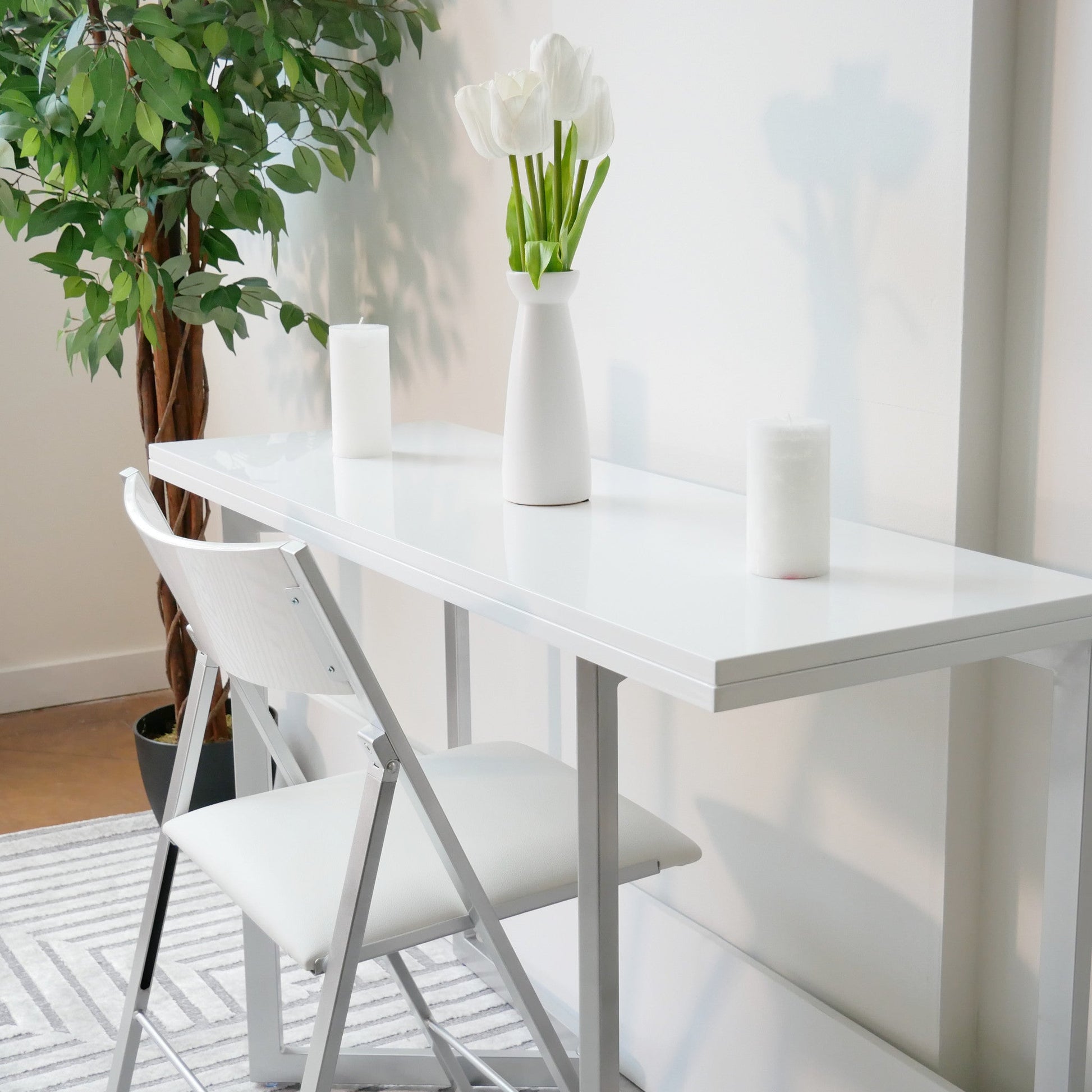 Flip-console-closed-in-glossy-white-being-used-as-a-small-desk-with-transforming-options