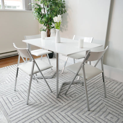 Flip-console-to-dining-table-in-glossy-white-opened-in-dining-form-with-4-nano-chairs-in-a-modern-room-with-grey-carpet