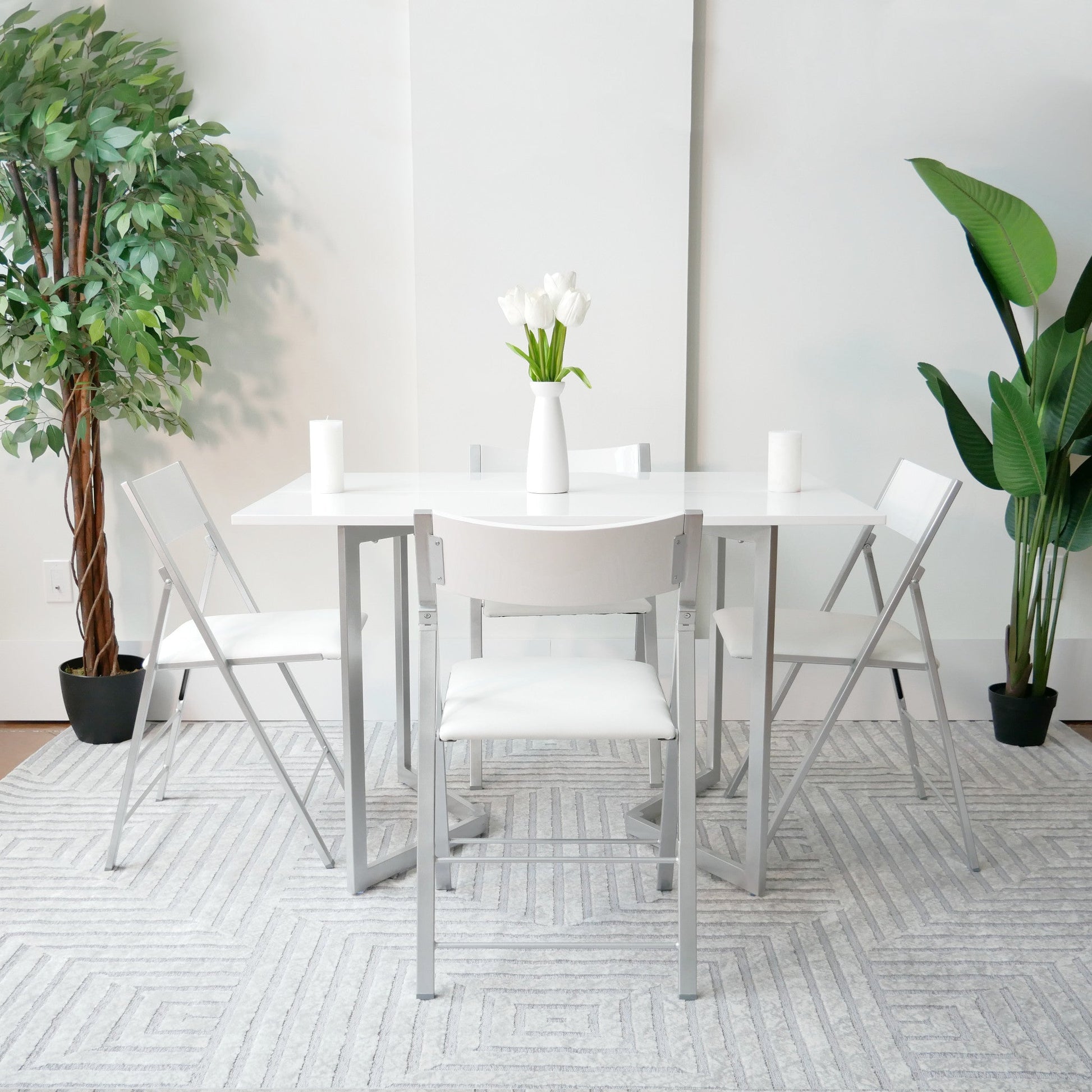 Flip-console-to-table-in-glossy-white-opened-in-dining-form-with-4-nano-chairs-in-a-modern-room-with-grey-carpet-from-side