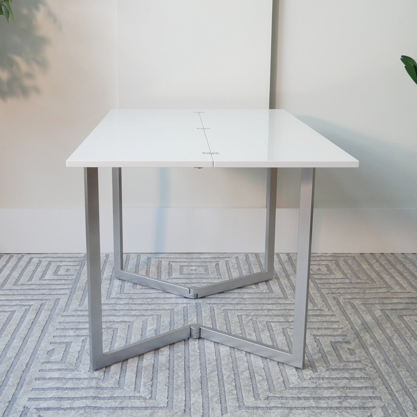 Flip-table-opened-up-with-no-decorations-ready-for-dinner-in-glossy-white