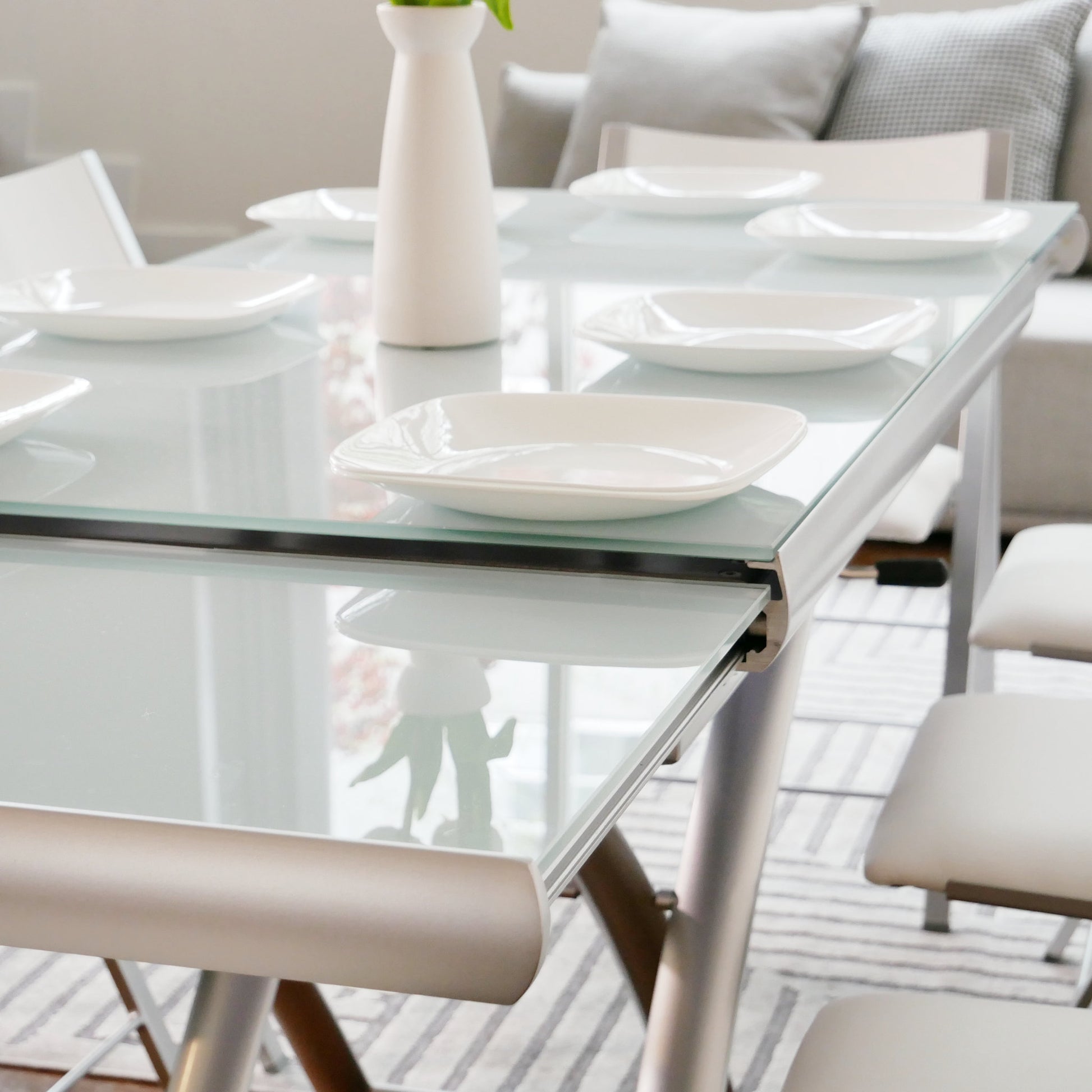 Horizon-white-grey-glass-table-extending-open-ready-for-dinner-transforming-glass-coffee-table