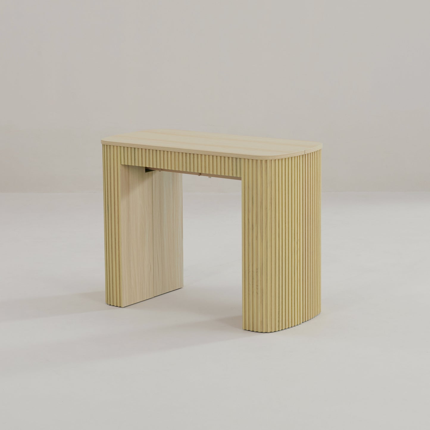 Junior Giant Curve in Oak wood as a compact extendable table