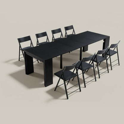 Black extending dining table with eight matching chairs on a beige background