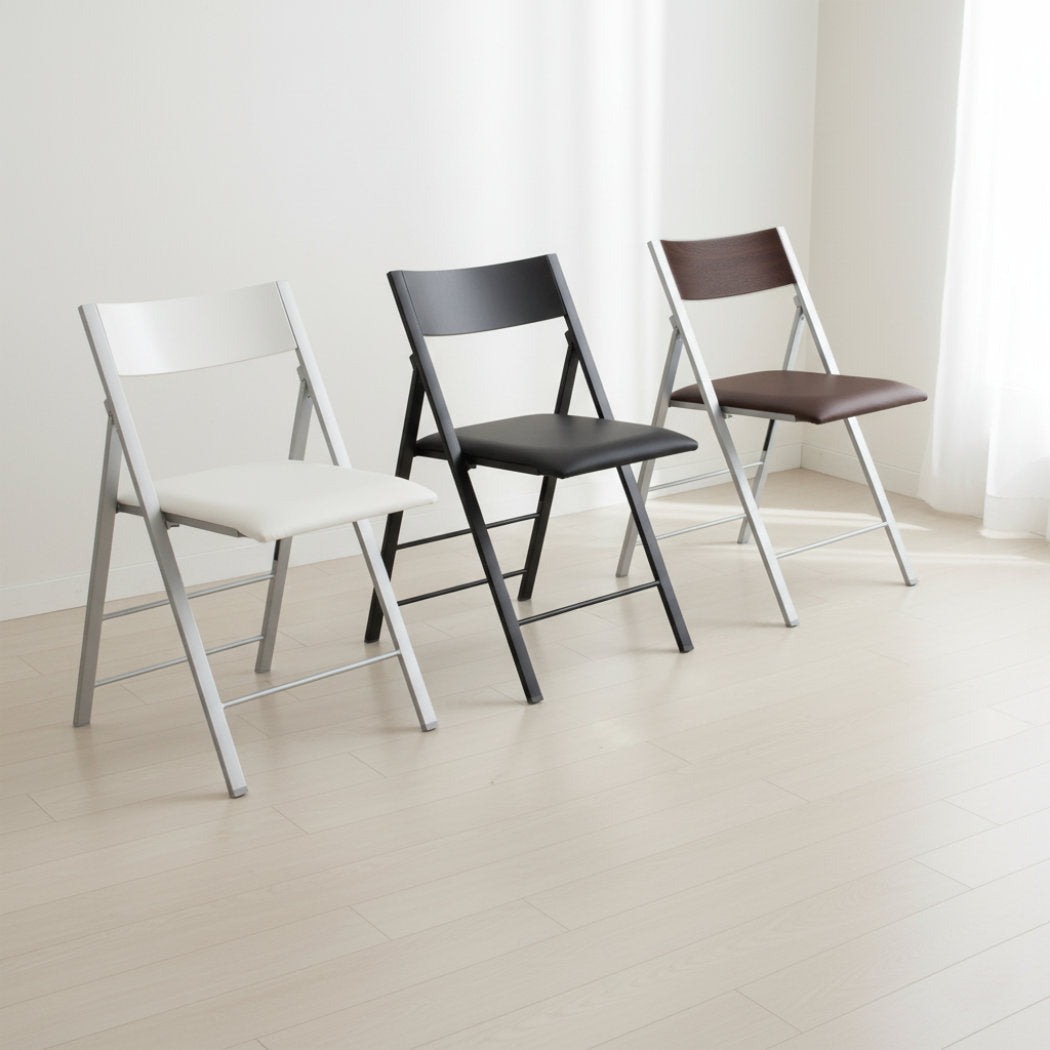 White - black and walnut Nano folding chairs showing color differences