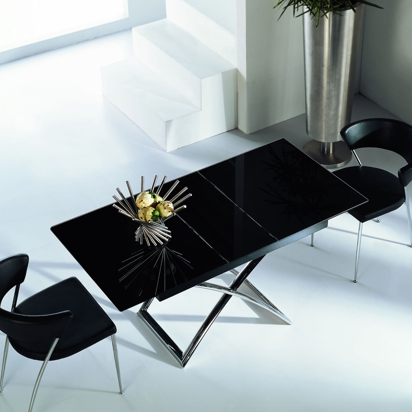 Obsidian black glass coffee to dinner table with chrome metal legs