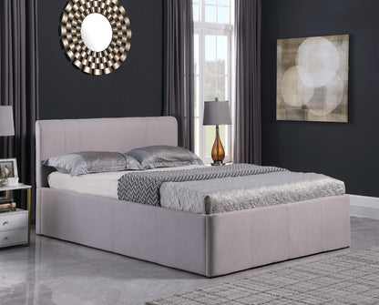 Gray upholstered bed in a modern bedroom with dark walls and decorative elements. Hidden storage inside accessed by lift