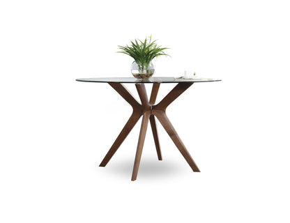 The-Branch-clear-glass-round-table-that-Rests-on-wood-legs