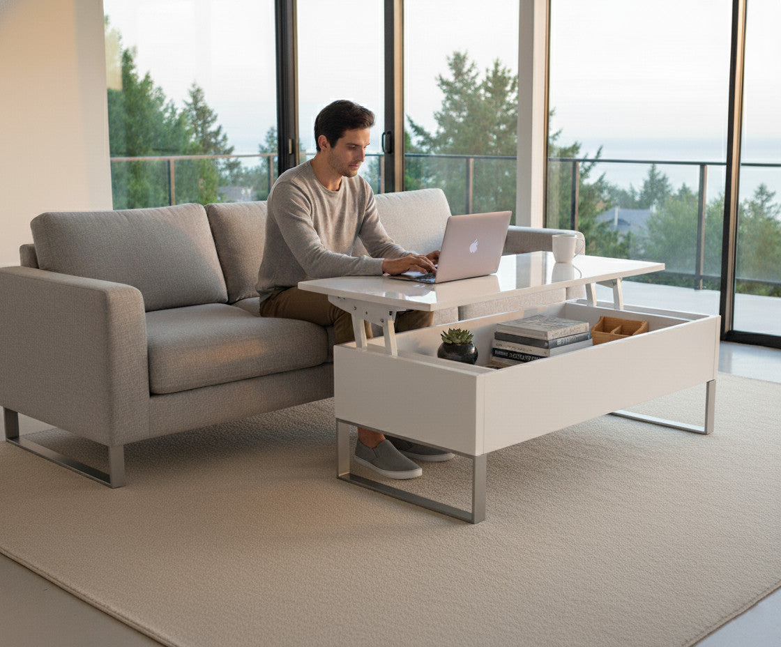 Person using a laptop on a modern living room sofa with a coffee table with raised and extended top.