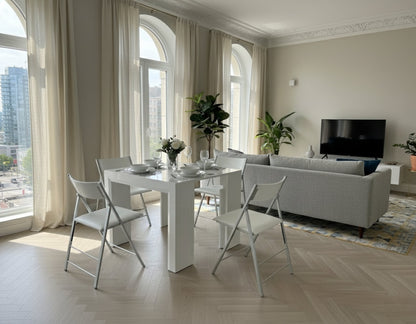 white gloss junior giant extending table with 1 extension added as a 4 person dinner table