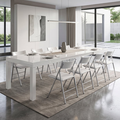 Pillar table extended in glossy white with nano chairs ready for dinner