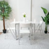 Flip-console-to-table-in-glossy-white-opened-in-dining-form-with-4-nano-chairs-in-a-modern-room-with-grey-carpet-from-side
