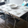 Expand-table-with-set-up-for-8-seats-around-table