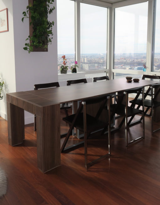 Cubist Extended walnut dinner table in designer apartment