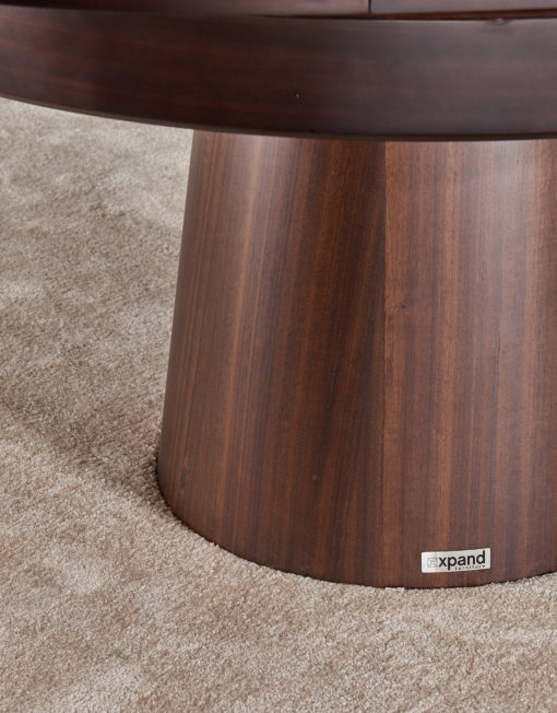 Close up of compass round expanding table top in walnut with base